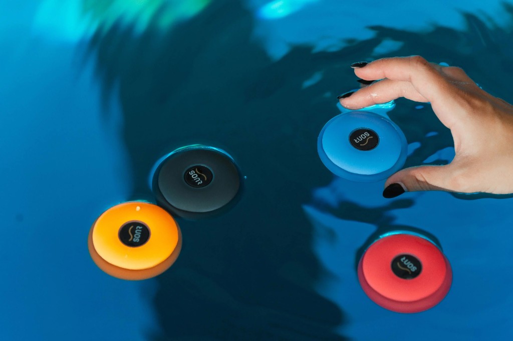 SONR Music devices floating in the pool